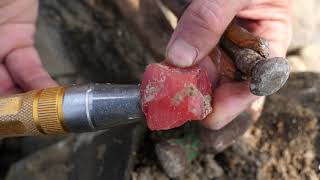 In the mineral veins on the seashore,gems and red crystals with the same color as the sky are formed