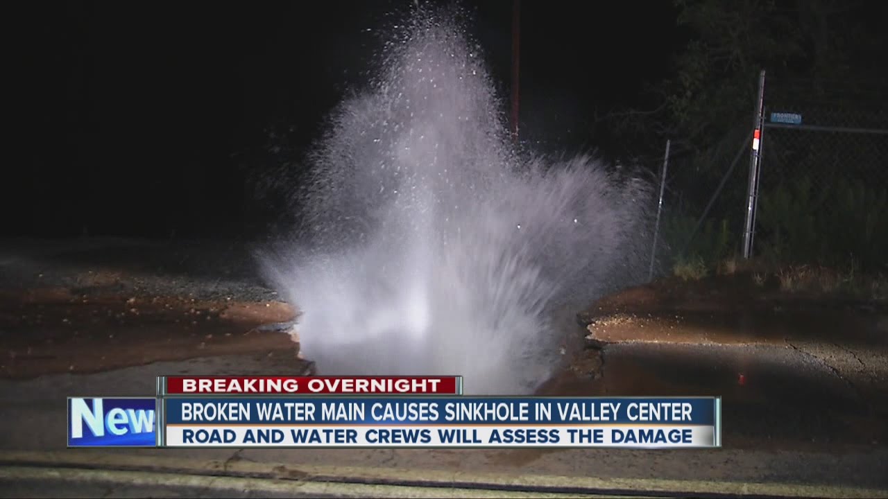 Water main break creates sinkhole in Valley Center - YouTube