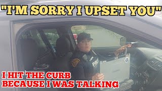 Flustered Female Cop Says She Hit Curb Because She Was Talking