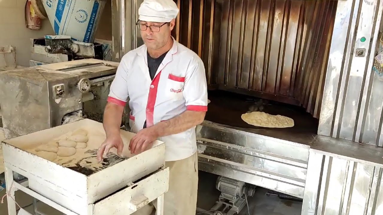 look at how this soft dough is turned to delicious and hard bread by fire