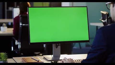 Businessman Working On The PC Computer Green Screen And Typing On The Keyboard in The Office