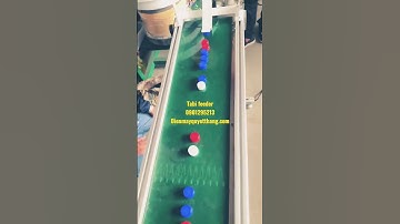 máy rung cấp nắp chai để in date