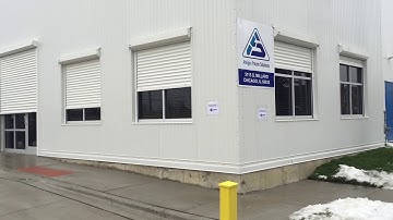 Automatic rolling shutters for a warehouse