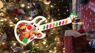 We Wish You a Merry Christmas on a TOY GUITAR