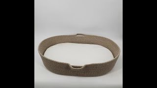 Cotton baby diaper changing basket with two handles.