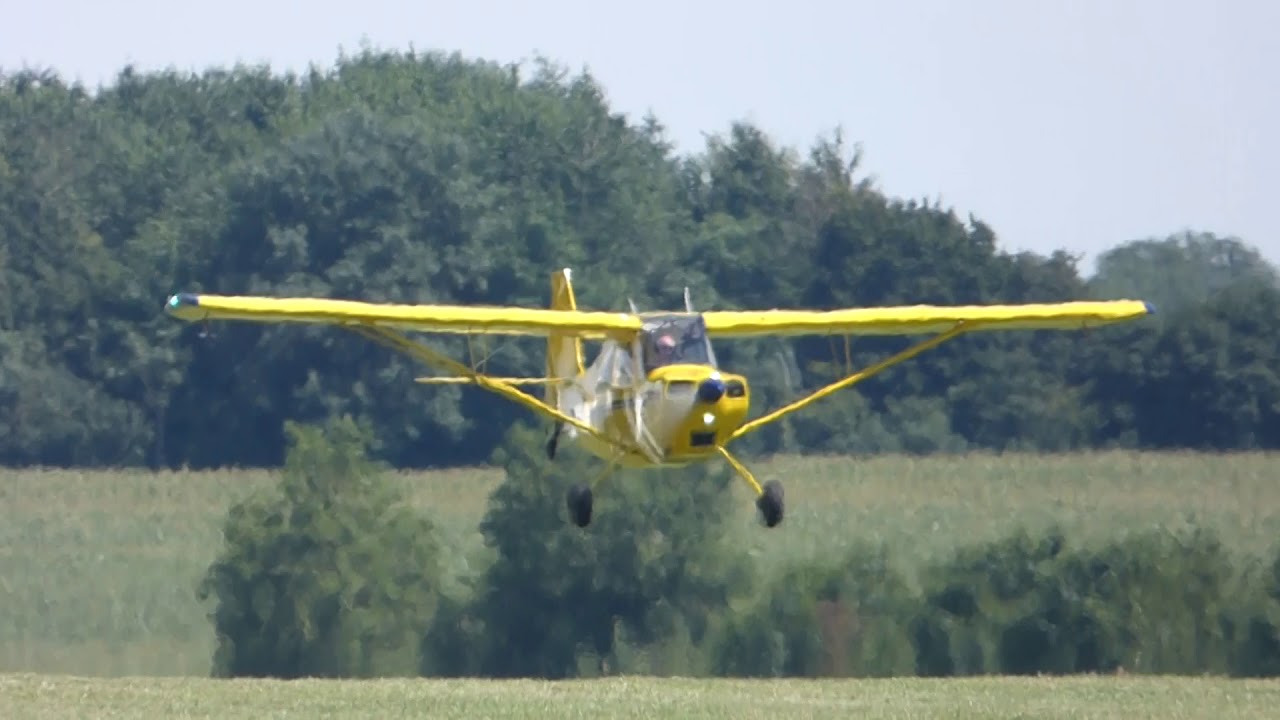 American Champion 7ECA Citabria Aurora landing at Kemble airfield.