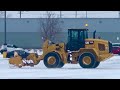 Snow Removal CAT Loader Plowing Snow