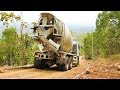 Hino 500 Ready Mix Cement Truck Delivering Pouring Concrete On Hill Road Construction