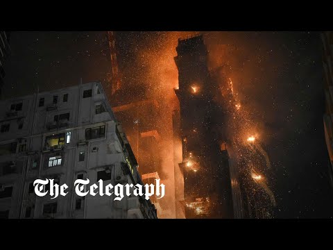 Hong Kong fire: Flames engulf high-rise in busy shopping district