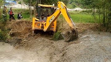 JCB Backhoe Machine Working For Bridge Construction-Bridge Foundation Construction in Water.