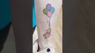 Winnie the Pooh holding balloons! #winniethepooh #colortattoo #lineworktattoo #illustrationtattoo