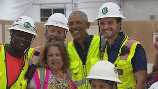 Obama surprises construction workers at presidential center site