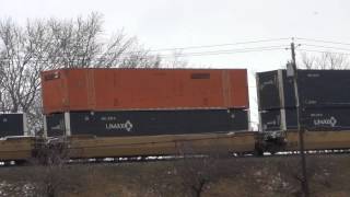 CSX Q004 Double Stack Train Powers By on Raised Tracks