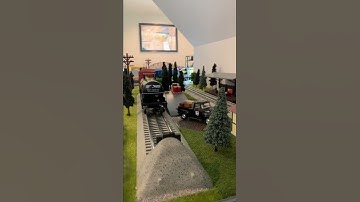 O-Scale Train Layout: Freight Train Leaves The Yard.