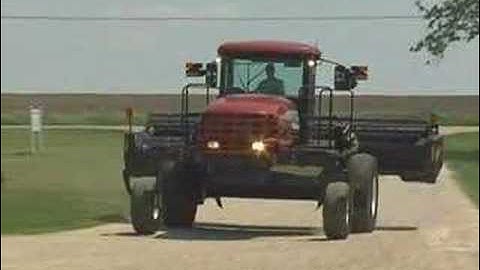 MacDon M150 SP Windrower Tractor drive-by