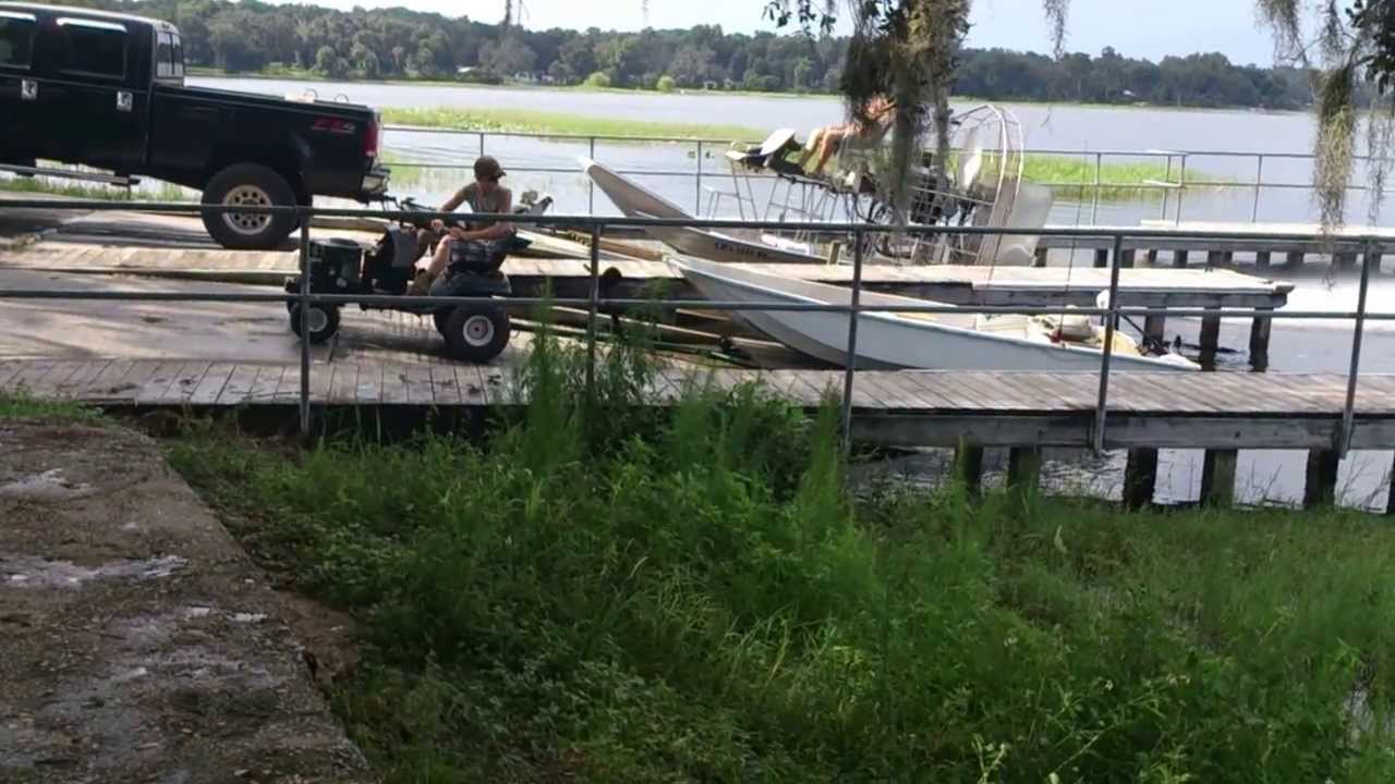 Lawn Tractor takes boat to boat ramp. - YouTube