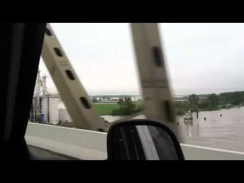 Driving east on Interstate 155 from Caruthersville MO to Dyersburg TN looking south. Just past the bridge, the Bunge grain bins can be seen with sandbags protecting it. Flood stage is 32 feet. River is at 44.3 feet with crest forecasted to be 48 feet on 5-7-2011. Video really doesn't show how much water there is. Couldn't capture everything on the MO side because of the trees.