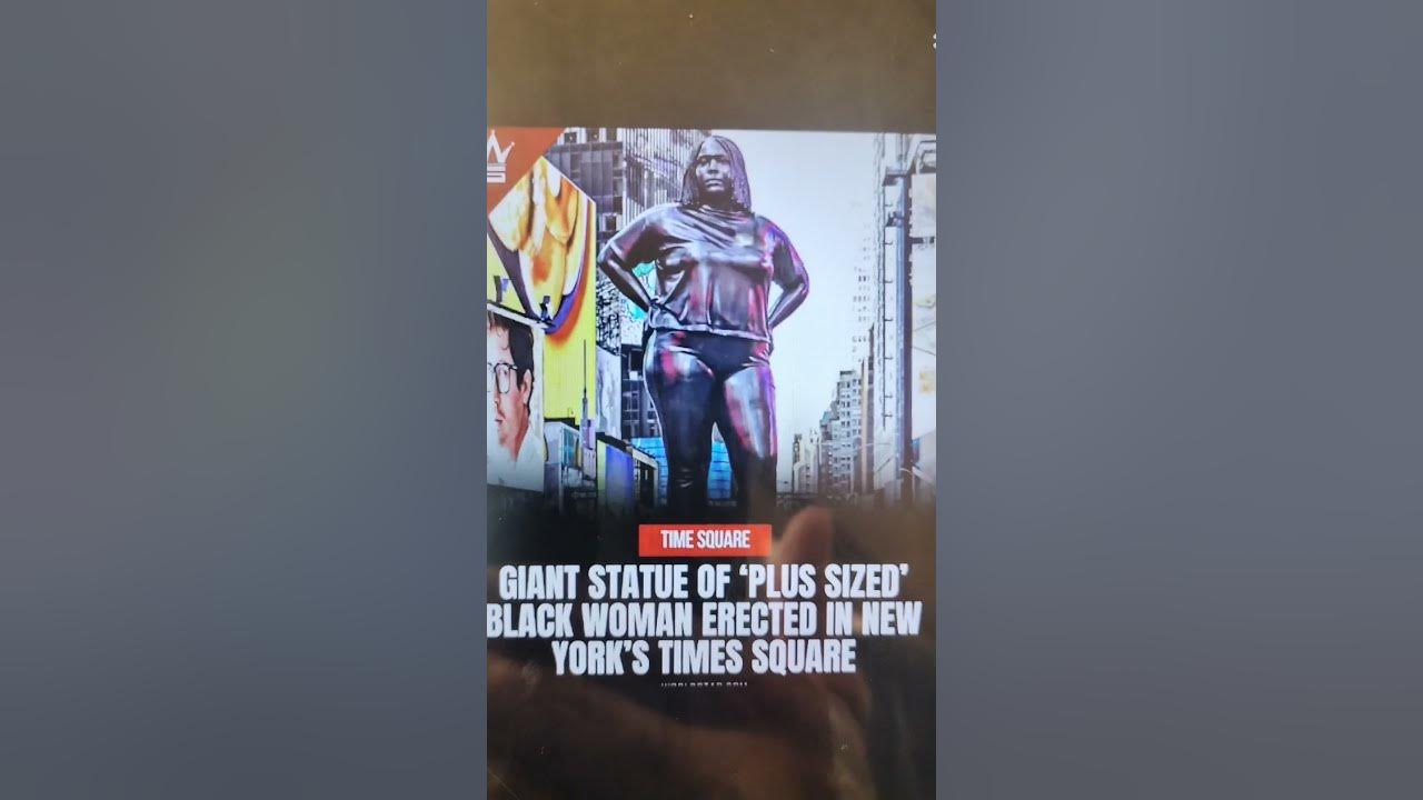 Black woman power size statue in times square ny for educational use