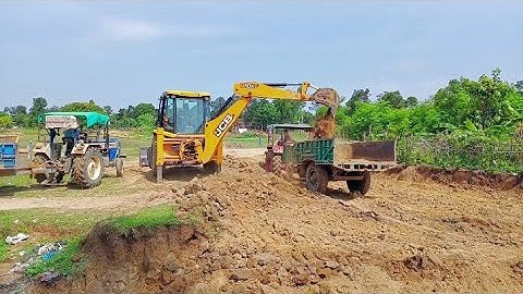 Mahindra 265 di by jcb backhoe machine loading in soil fully loaded trolley | jcb or tractor video