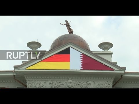 Germany: Cover up! Qatari Embassy in Berlin hides relief of nudes with flags