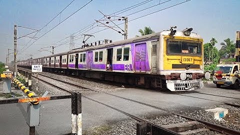 Colourful Conventional EMU Local Train speedily passing Busy Railgate | Trains at Level Crossing
