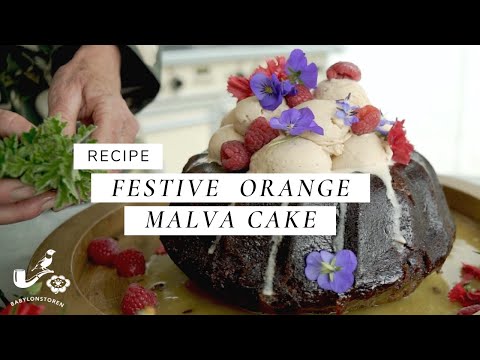 Festive Orange Malva Cake with Ice Cream and Edible Flowers Recipe