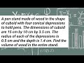 A pen stand made of wood is in the shape of a cuboid with four conical depressions to hold pens.