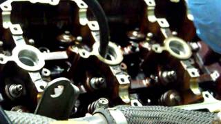 Removing valve spring retainers and keepers on a 3000GT DOHC