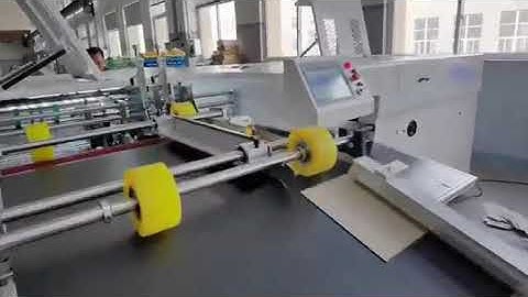 Rigid box V grooving machine with corner cutter