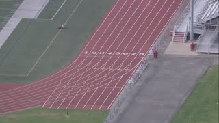 Off-duty firefighters save teenager after he collapses at track meet
