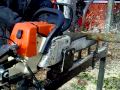 Cutting logs on chainsaw bench Cutting logs on chainsaw bench