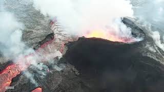 Lava erupting from within the 120-foot-high fissure 8 cinder cone built of chilled lava fragments.
