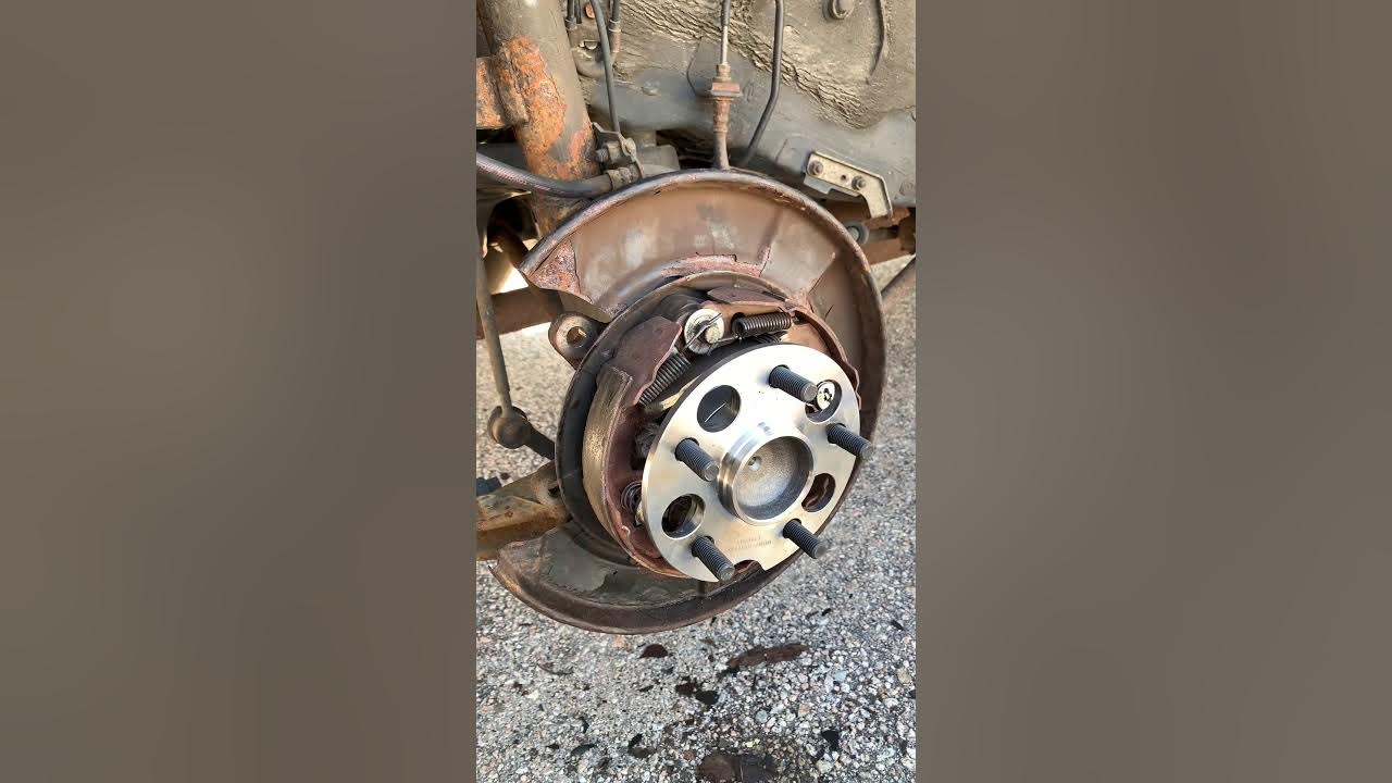 How to replace rear wheel bearing and nut assembly 2wd 2005 Toyota