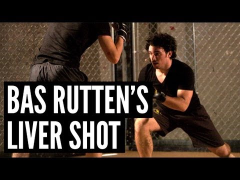 Get Squid's 10 secret moves! mmasurge.com How to Pull It Off: 1. Establish your stance. 2. Step forward with left foot. 3. Turn shoulders left, so your right shoulder is above your left knee. 4. Throw a left hook. Aim at a 45-degree angle and hit mid center of opponent's abdomen, on the right side. 5. Keep your right hand by your face to block. Bang, that's Bas Rutten's infamous liver shot. In case you didn't know, the liver's on the right side of the abdomen. One hard strike'll cause extreme pain all through the body, so do it right and you'll walk away the winner. Top 5 MMA Surges: 1. Bas Rutten's Liver Shot: www.youtube.com 2. The Triangle Choke: www.youtube.com 3. Rear Naked Choke: www.youtube.com 4. Double Leg Takedown: www.youtube.com 5. The Guillotine: www.youtube.com About Squid: Originally from Queens, NYC, The Squid has a history of taking down the competition. He has dominated at Vale Tudo contests, Grappler's Quest Nationals, even the National Fighting Championship. Follow him on Twitter at www.twitter.com
