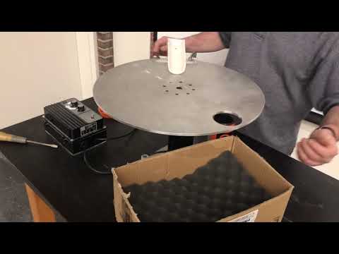1E30.28 Ball on a Rotating Turntable with Ramp and Hole