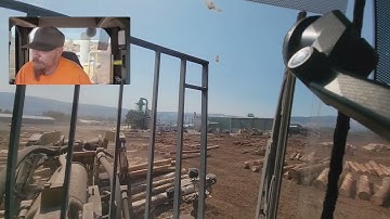 Unloading a log truck with a Caterpillar 988H
