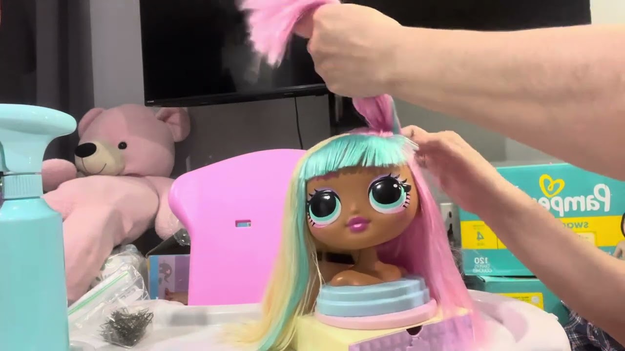 Hair brushing and hair styling on doll head , some soft spoken