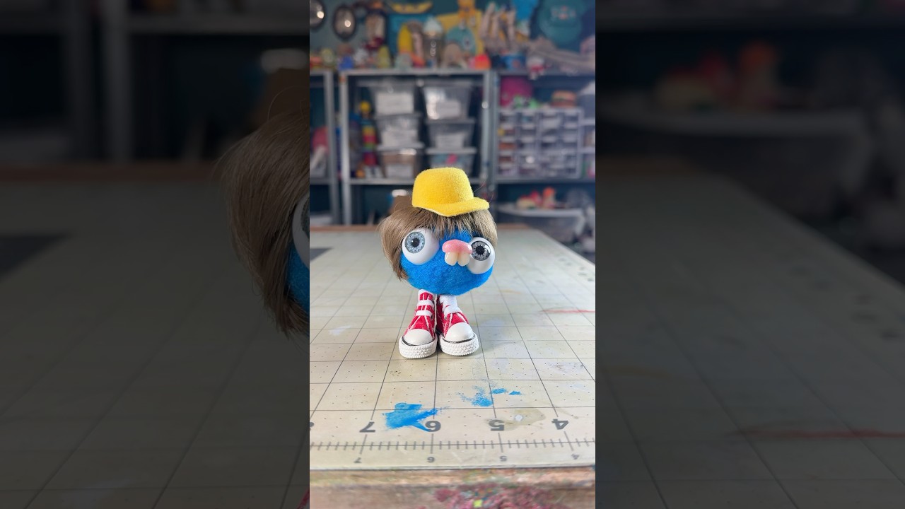 PomPom blob with a wig and shoes