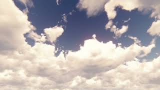 Blue sky with beautiful cloudscape with large clouds and sunlight breaking through cloud mass in