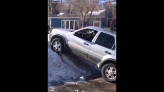 Ford escape climbing a snow pile
