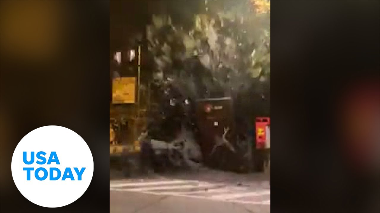 Pedestrians scatter as a powerful mudslide overtakes busy town | USA TODAY