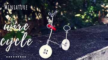 Miniature cycle made out of wire and buttons. Best way to recycle buttons.