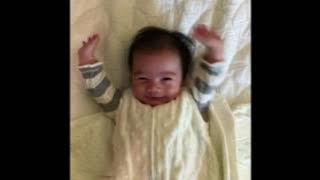 Cute baby throws his hands up after being unswaddled - KPtheBaby