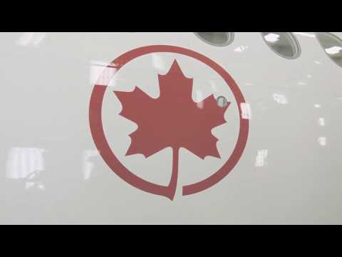 The first A220 for Air Canada rolls out of the painting hangar