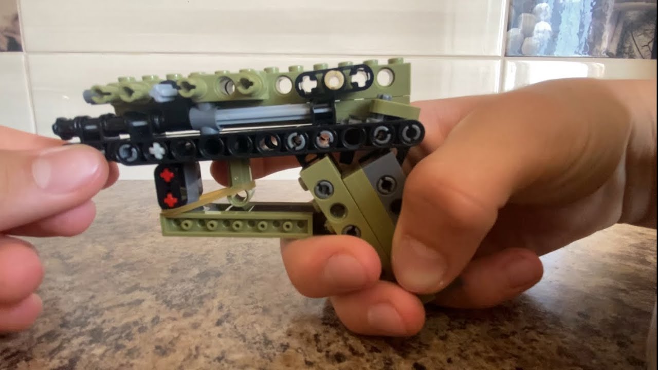 LEGO RUBBER BAND GUN WITH SELL EJECTION MECHANISM