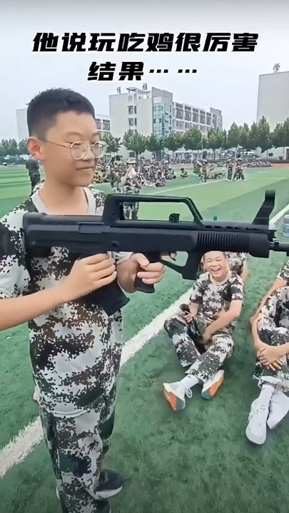 Chinese kid using QBZ-95 Training model in a hilarious way