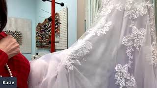 Adding a bustle to a wedding gown.