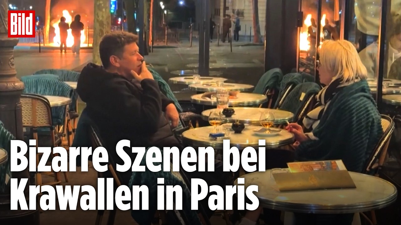 FRANKREICH-KRAWALLE: Paar schlürft genüsslich Drinks vor brennenden Barrikaden am Arc de Triomphe