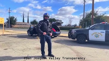 Officer FEARS CAMERAS so he calls for BACKUP!