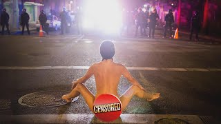 Naked Protester Does Yoga Poses in Front of Cops